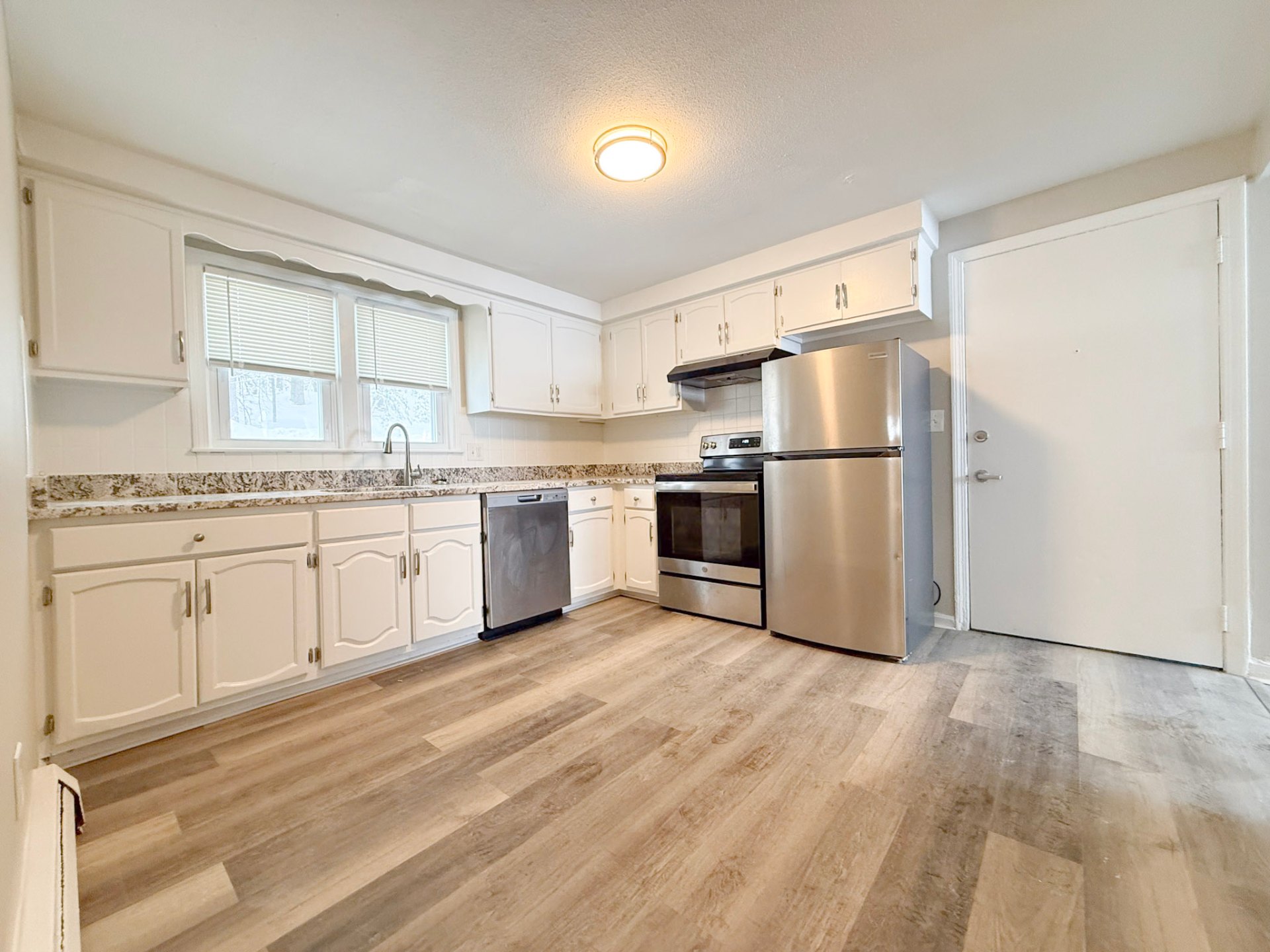 Rosewood Apartments — kitchen with stainless appliances