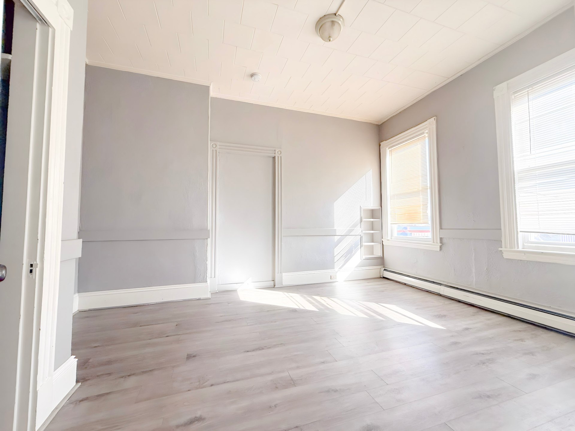 42 East Broadway — bright room with new flooring